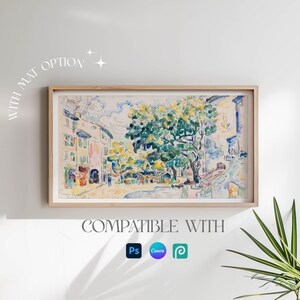 May include: A framed watercolor painting of a street scene with buildings and a large tree in the center. The painting is in a light wood frame and has a white mat. The text "WITH MAT OPTION" is written in a white, cursive font in the upper left corner of the image. The text "COMPATIBLE WITH" is written in a white, sans-serif font below the painting. The logos for Photoshop, Canva, and Procreate are displayed below the text.