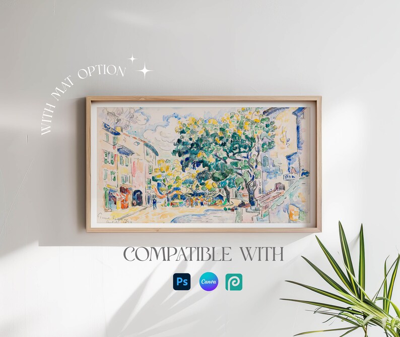 May include: A framed watercolor painting of a street scene with buildings and a large tree in the center. The painting is in a light wood frame and has a white mat. The text "WITH MAT OPTION" is written in a white, cursive font in the upper left corner of the image. The text "COMPATIBLE WITH" is written in a white, sans-serif font below the painting. The logos for Photoshop, Canva, and Procreate are displayed below the text.
