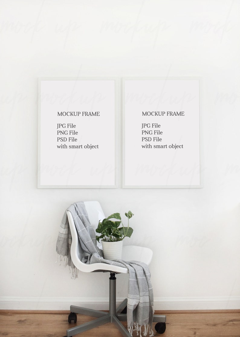 May include: Two white picture frames with black text that reads "MOCKUP FRAME" and lists "JPG File", "PNG File", "PSD File", and "with smart object". The frames are hanging on a white wall. A white chair with a gray and white blanket draped over it sits in front of the frames. A potted plant sits on the chair.