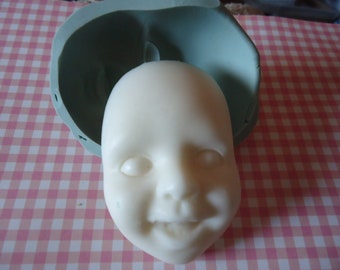 silicone mold of smiling child face for wepam fimo clay