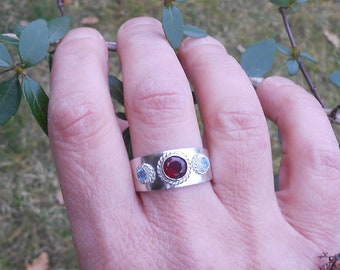 Unique custom ring blue topaz and garnet