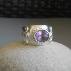 Unique handmade 950 silver ring set with a faceted oval-cut amethyst