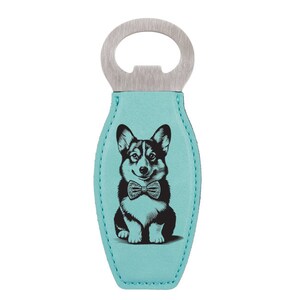 May include: A turquoise blue leather bottle opener with a stainless steel top. The opener features a black and white illustration of a corgi wearing a bow tie.