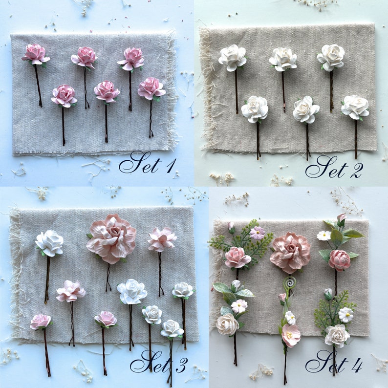 May include: Four sets of floral hair clips. Set 1 has eight pink flower hair clips. Set 2 has eight white flower hair clips. Set 3 has eight flower hair clips with a mix of pink and white flowers. Set 4 has eight flower hair clips with a mix of pink and white flowers and green leaves.