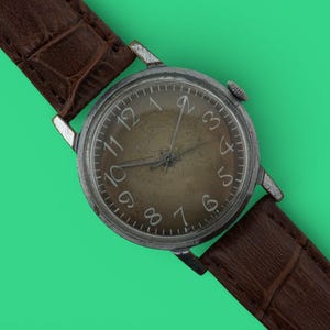 Montre-bracelet mécanique vintage soviétique Raketa cal.2609 URSS 16 rubis