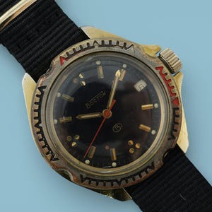 Vintage military wristwatch Vostok Komandirskie diver watch, black dial, brass case