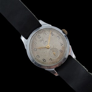 Orologio da uomo vintage dei primi anni '60 Raketa Svet ZCHL orologio da polso meccanico sovietico con cassa cromata