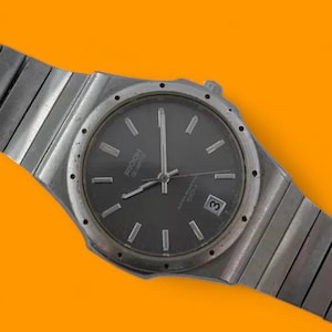 Vintage Ricoh Quartz 100m all steel mens watch