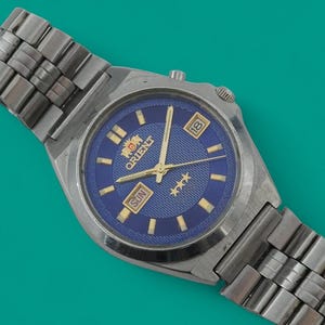 Vintage automatic Japan watch ORIENT 3 star 21 jewels mechanical wristwatch, stainless steel case, blue dial