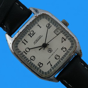 Relógio de pulso masculino mecânico vintage soviético Raketa 2614.H com 19 rubis e indicador de data.