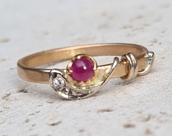 Ready to ship, modern stacking ring in 18K yellow, white and red gold, a ruby and a diamond.