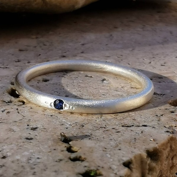 Silver 925 wedding ring and a sapphire.