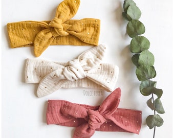 Bandeau cheveux à nouer pour bébé en double gaze à pois dorés. Avec ou sans élastique.
