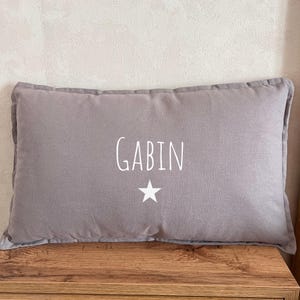 Rectangular school nap cushion with customizable and removable cover and first name