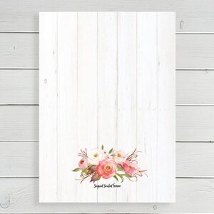 May include: A white wood background with a floral design in shades of pink and white. The flowers are arranged in a cluster and have a watercolor effect. The text "Signed Sealed & Delivered" is printed below the flowers.
