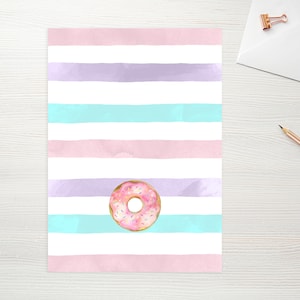 May include: A pink and white striped background with a pink frosted donut with sprinkles in the center.