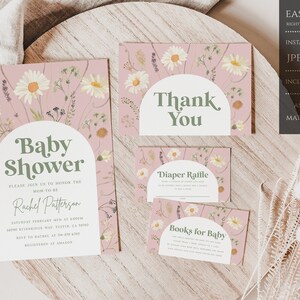 May include: A set of printable baby shower cards with a pink floral design. The cards include a baby shower invitation, a thank you card, a diaper raffle card, and a books for baby card. The text on the cards reads "Baby Shower", "Thank You", "Diaper Raffle", and "Books for Baby".