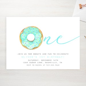 May include: A light blue and yellow donut with colorful sprinkles, the number "one" in a light blue cursive font, and the text "JOIN US FOR DONUTS AND FUN TO CELEBRATE OLIVER'S 1ST BIRTHDAY! SATURDAY, NOVEMBER 16TH 1200 SUGAR LANE NASHVILLE, TN RSVP TO RACHEL AT 949-350-9860" on a white background.