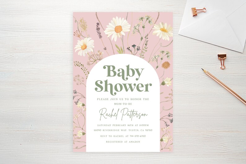 May include: A pink baby shower invitation with a white arch and green text that reads "Baby Shower". The invitation is decorated with white daisies and other floral elements.