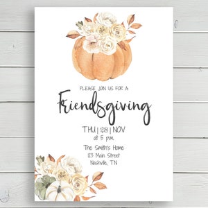 May include: A white card with a watercolor illustration of a pumpkin with fall flowers. The text on the card reads "PLEASE JOIN US FOR A Friendsgiving THU | 28 | NOV at 5 p.m The Smith's Home 123 Main Street Nashville, TN"