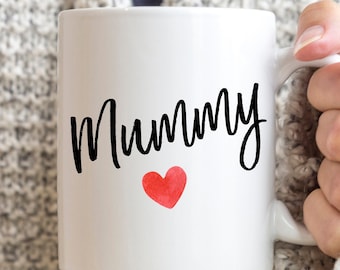 May include: White ceramic mug with the word "Mummy" in black script and a red watercolor heart.