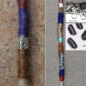 May include: A close-up of a colourful synthetic hair extension with a silver bead. The extension is made of multiple strands of yarn in different colours, including brown, white, blue, and red. The bead is silver and has a decorative design. The image also shows a variety of hair accessories, including mini hair bands and weft clips.