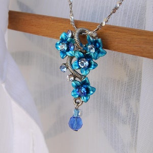 Blue Flower Pendant Necklace: Rhinestone Floral Bouquet, Steel Chain