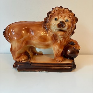 Antique 19th century English Staffordshire lion with ball figurine