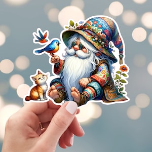 May include: A whimsical gnome with a long white beard, wearing a colorful hat and a patterned vest, sits with a blue bird and a small orange cat. The gnome is holding a flower in its hand.