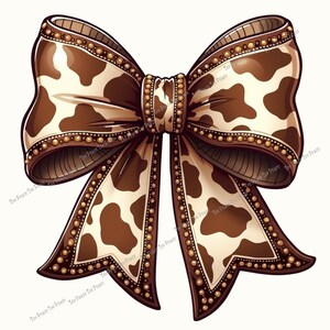 May include: A decorative bow with a cow print design. The bow features a brown and cream color scheme with a repeating pattern of brown spots. The edges are outlined with a darker brown and adorned with small gold-colored beads.