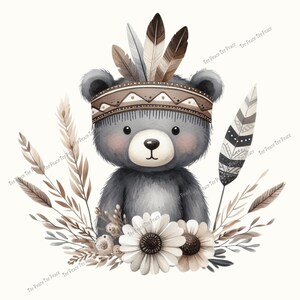 May include: Watercolor illustration of a gray teddy bear wearing a Native American headdress with feathers. The bear is surrounded by white flowers, wheat, and feathers, all set against a cream background. The text "Tee Peace Tee Peace" is repeated around the image.