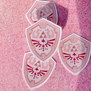 Leyenda de Zelda Hylian Shield Aliento de lo salvaje Rosa Oro rosa Pegatina