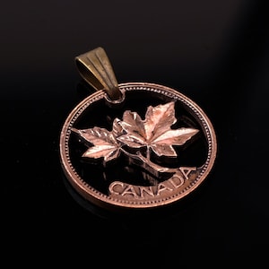 1965 Canada 1 cent A maple leaf twig Cut coin pendant with necklace Hand cut 19 mm. image 1