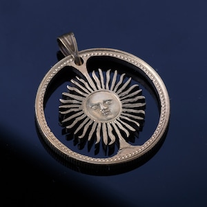 Argentina Peso Sun cut coin pendant with necklace.  Buenos Aires