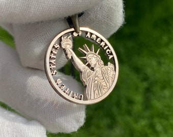 Cut Coin Pendant Backside of a Presidents Dollar Coin With the Statue of Liberty