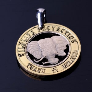 Venda Wildlife Protection  2013 Cut coin pendant Finnish lion Helsinki Suomalaiset