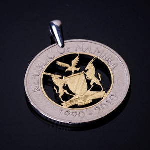 Numibian coat of arms antelopes shield Cut Coin Pendant with Necklace. Hand cut.