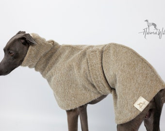 May include: A brown dog sweater with a high neck and a small brown leather patch with a letter 'B' on it. The sweater is made of a soft, fuzzy material and is worn by a grey Italian Greyhound.