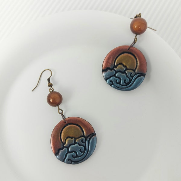 boucle d'oreilles noir, bleu et or, motif vague et soleil, 2 versions, perle de verre bleue ou marron, fait-main en France