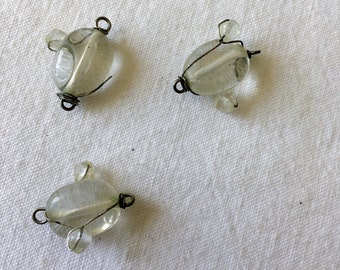 A set of transparent glass and wire metal wire pucks. Vintage beads in translucent glass, white. Simple wire beads for DIY.