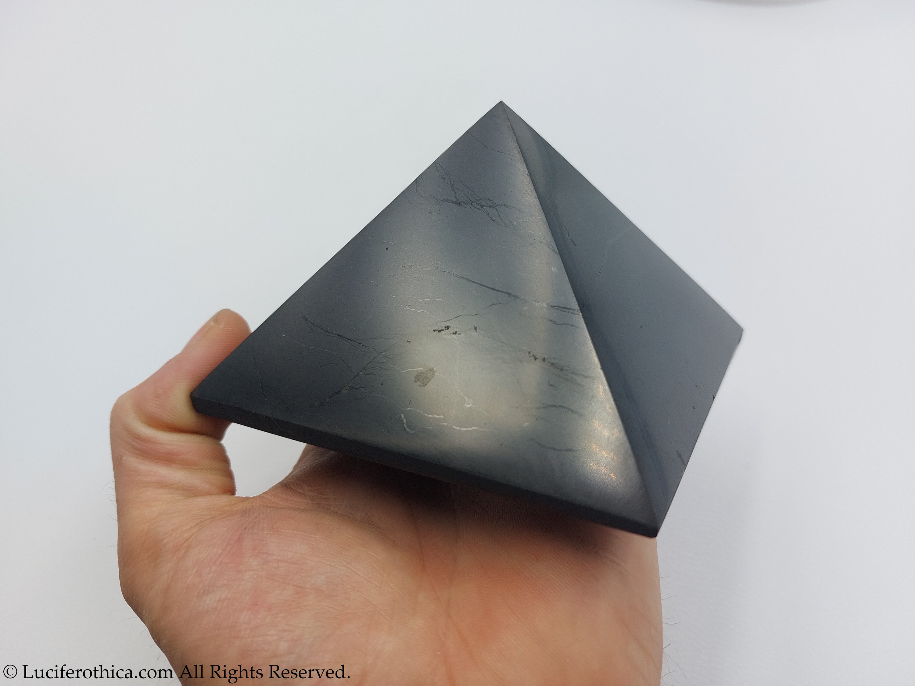 Shungite polished pyramid with clock 10 cm 