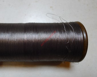 antique wooden bobbin with silk