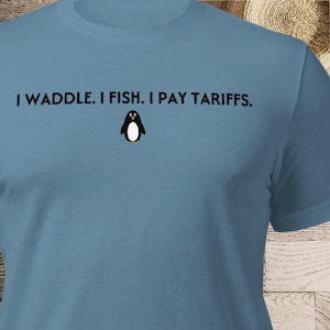 Penguin Tariffs, Tariffied, T Shirt, Waddle Fish Pay Tariffs, Protest, Resist, Heard Island, Lizzo Tariffied Unisex t-shirt