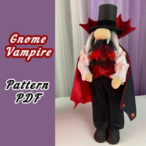 May include: A red and black gnome vampire doll wearing a black top hat, a red cape, and a white shirt with a black lace collar. The doll has a white beard and fangs. The text "Gnome Vampire Pattern PDF" is visible in the image.
