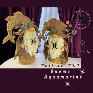 May include: Two handmade gnome figurines with fish hats and Pisces zodiac symbols. The gnomes are wearing brown robes with gold accents and have white yarn beards. The gnomes are standing on a white surface. The image includes the text "Pattern PDF Gnome Aquamarine".