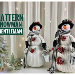 May include: Two white snowman figures with black and white striped scarves, black hats, and red flower accents. The snowman on the right is holding a small silver bucket. The text "PATTERN SNOWMAN-GENTLEMAN" is in the upper left corner of the image.