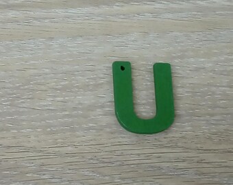 Charm wood representing the letter U