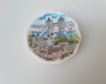 Miniature collection plate representing london