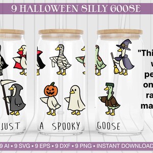 May include: Three clear glass tumblers with wooden lids, each featuring a Halloween-themed goose design. The designs include a skeleton, vampire, mummy, witch, and Frankenstein. Text on the tumblers reads "Just a Spooky Goose."