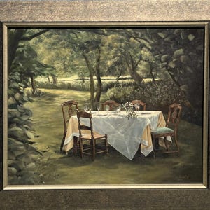 May include: Oil painting of a dining table set for a meal in a garden setting. The table is covered with a white tablecloth and set with plates, glasses, and flowers. Six wooden chairs surround the table, and the background features trees and foliage.